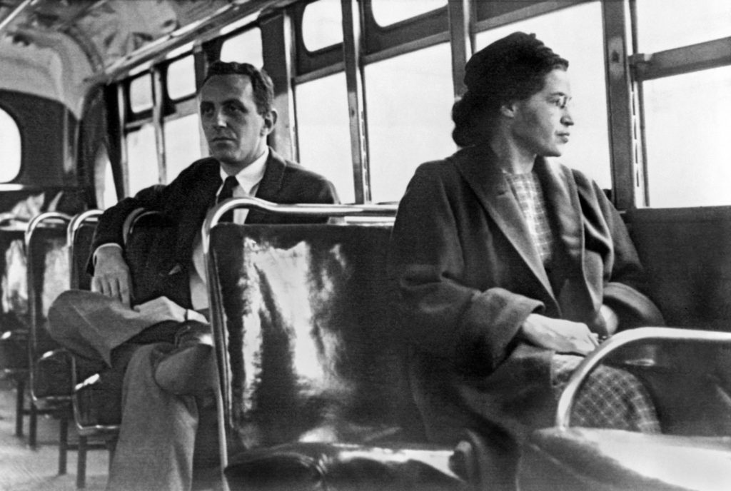 Rosa Parks riding a Montgomery bus immediately following the decision to desegregate buses. 